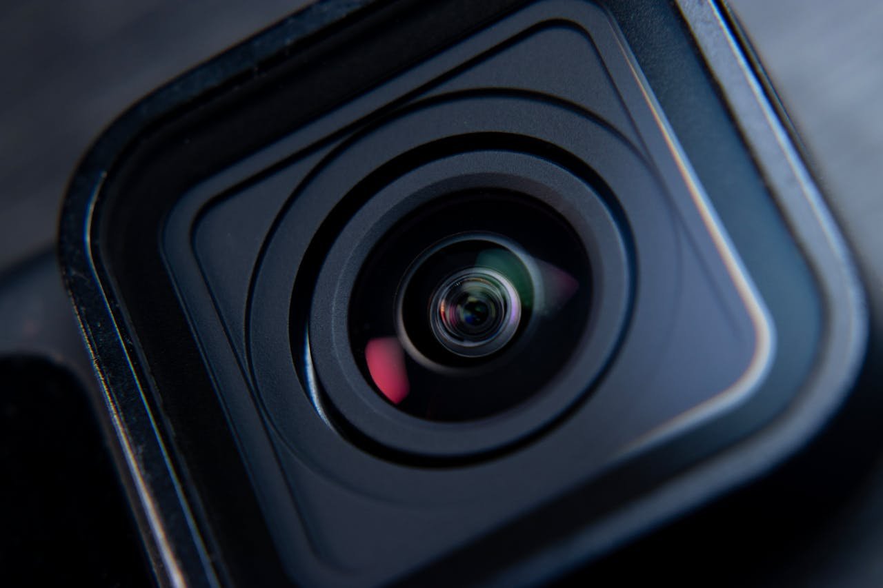 Detailed shot of a camera lens focusing on lens structure and reflections.